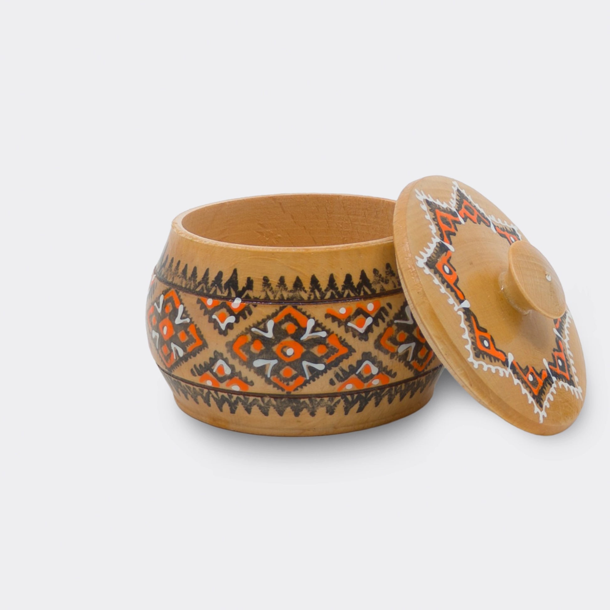 Boîte en bois ukrainienne peinte à la main, objet décoratif simple et graphique.