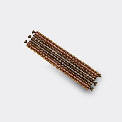Bracelet tissé brun doré en coton, aux motifs géométriques inspirés du folklore balkanique, vue dépliée